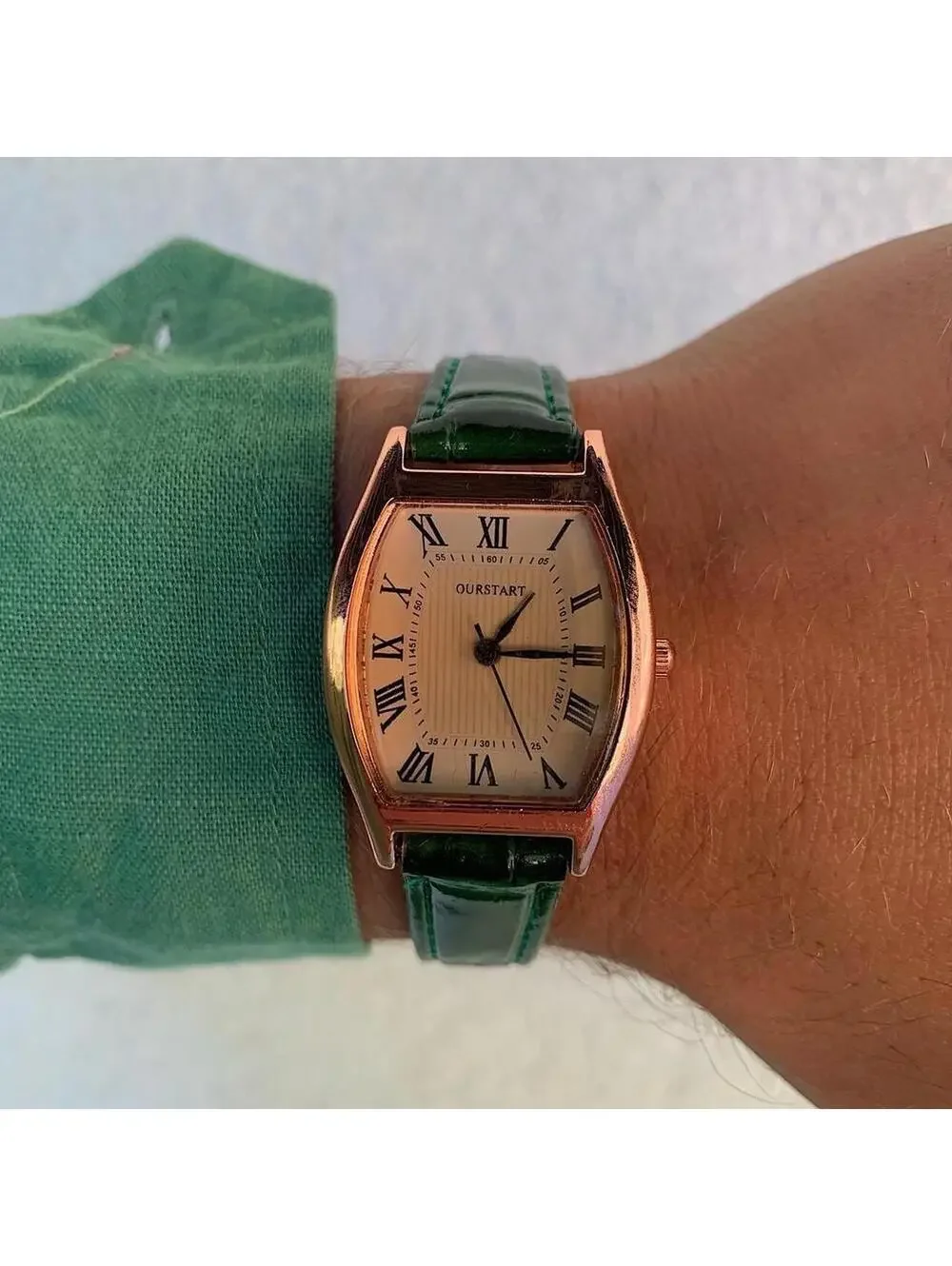 Minimalistic essential vintage style gold and green leather style band watch. 9